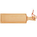 A Boska beech wood serving board with an orange handle.