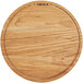 A round wooden Boska serving board with a logo.