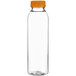 A clear round PET juice bottle with an orange cap.