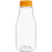 A clear plastic round juice bottle with an orange lid.