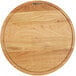 A Boska large round wooden serving board with a circular design.