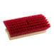 A close-up of a Lavex 10" bi-level floor scrub brush with a red brush and wooden handle.