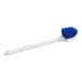 A Lavex blue scrub brush with blue bristles on a white handle.