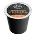 A black box of Ellis Mezzaroma Decaf Royal Sumatra Coffee Single Serve Cups on a counter. The box has a white and orange label.