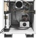 A white metal Primo coffee roaster with wires and a fan.