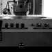 A black Primo RAVEN-Xr15 coffee roaster machine.