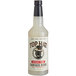 A bottle of Top Hat Provisions Sugar-Free Spicy Ginger Beer concentrate with white liquid inside.