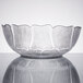 A clear Arcoroc glass bowl with a pattern on it.