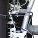 A close-up of the Primo GENESIS-Xr3 commercial coffee roaster with internal cyclone.