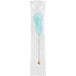 A blue cotton candy swizzle stick with white wrapping in a clear plastic bag.