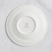 A white RAK Porcelain deep plate with a crown logo.