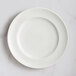 A white RAK Porcelain flat plate with an embossed floral pattern.