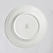 A white RAK Porcelain flat plate with an embossed floral design.