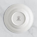 A RAK Porcelain ivory deep plate with an embossed crown logo on the rim.