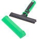 A green and black plastic Unger ErgoTec glass scraper handle.