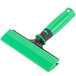 An Unger ErgoTec glass scraper with a green and black handle.