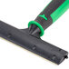 A green and black Unger ErgoTec glass scraper handle.