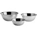 A set of three stainless steel Choice standard mixing bowls.