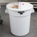 A white Rubbermaid ingredient storage bin with a sliding lid.
