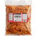 A plastic bag of Lucky Foods Spicy Kimchi with a label.