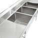 A Regency stainless steel commercial sink with three compartments and two drainboards.