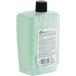 A plastic container of Dial Versa Professional Basics green liquid hand soap with a label.