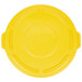 A yellow plastic lid for a Rubbermaid BRUTE trash can.