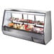 A True stainless steel shelf in a food display case with meat and cheese.