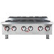An APW Wyott countertop range with six burners on a stainless steel counter.