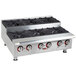 A large stainless steel APW Wyott countertop gas range with black knobs over four burners.