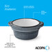 A small stoneware sauce cup with a deep blue matte speckled exterior, glossy white interior, and a dark banded edge.