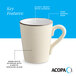 A cream white matte stoneware mug with a speckled glaze, glossy white interior, and a dark banded edge.
