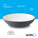 A stoneware pasta bowl with a glossy white interior, dark banded edge, and a deep blue matte speckled exterior.