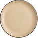 An Acopa Harvest Tan matte coupe plate with a black rim.