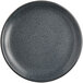 A close up of a midnight blue matte Acopa Embers coupe plate with speckles.
