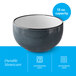 A 13 oz. midnight blue matte stoneware bowl with a white interior.