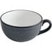 A black and white matte stoneware cup with a white rim.