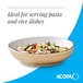 A tan matte stoneware pasta bowl filled with a pasta dish.