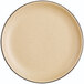 An Acopa Harvest Tan matte coupe stoneware plate with black dots on it.