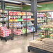 A Steelton black wire shelving kit with black shelves, 72" posts, and casters in a grocery store filled with food.