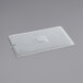 A translucent polypropylene plastic lid with a square hole in it.
