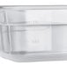 A Vigor translucent polypropylene food pan with a clear lid.