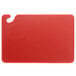 A San Jamar red plastic cutting board with a hook.