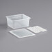 A white translucent plastic container with a white lid and drain tray.