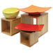 A Tablecraft Barclay 3-piece Square Bamboo Riser set holding bowls on a table.