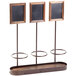 An American Metalcraft wine display stand with three rectangular wooden shelves and black chalkboard labels.