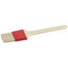 A red Choice pastry and basting brush with a white plastic handle.