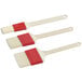 A Choice 3-piece pastry and basting brush set with red handles and white bristles.