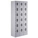 A gray Regency Space Solutions metal locker with many compartments.
