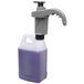 A purple plastic container with a white lid and a grey plastic pump handle.